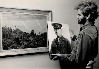 War drawings. Steven Lemon of the McMichael gallery holds a World War I photograph of A. Y. Jackson, who served as an official war artist to the Canad(...)