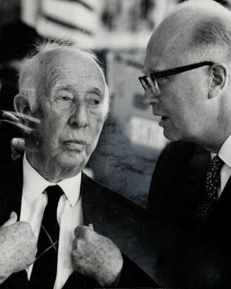 Old pro looks at Younge art. Artist A. Y. Jackson, one of the original members of the Group of Seven, talks with publisher Russell Smith (right) at an(...)