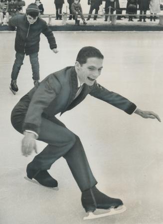 Imitating the master, Gerry Granvina, 11, tries stimulating spin of former world skating champ Don Jackson at City Hall rink. Jackson, who headlines I(...)