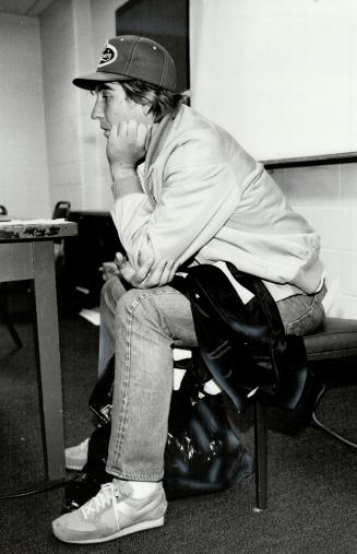 Ponders future, Argos' quarterback Mark Jackson strikes a thinking pose just before leaving Exhibition Stadium yesterday. Team, after a losing record,(...)