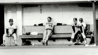 Lonesome Angel, California Angels' designated hitter last night, Reggie Jackson (44), has the visitors bench all to himself at Exhibition Stadium as h(...)