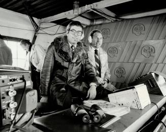 Don Chevrier (left) and Russ Jackson provide commentary and color during the game