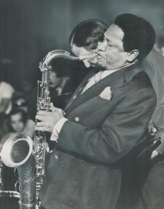 Illinois Jacquet, not playing saxophone in a Toronto club, was a longtime friend of Louis Armstrong and eulogized him at a musical memorial service ye(...)
