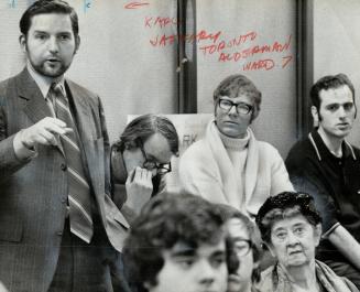 Alderman Karl Jaffary (left) urges citizens to get out and help elect new aldermen in 1972 who are willing to take a new approach to city planning
