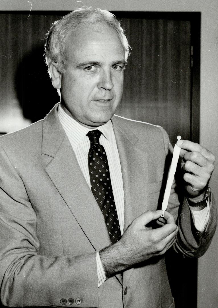 Artificial ligament, Dr. Peter Janes holds knee ligament replacement that's made of synthetic fibre and speeds recovery