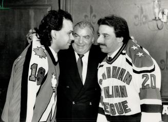 Squaring off for a good cause. Macedonian captain Nick Servinis (left) gives Italian counterpart Tony Pusateri the old evil eye at a promo for Monday'(...)