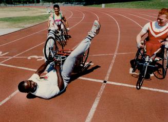 Ben's back on track! When Ben Johnson lined up between elite wheelchair athletes Andre Viger, left, and Jeff Adams, it was (up and) over pretty quick.(...)