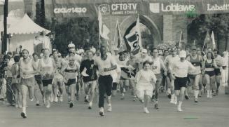 Ben leads the way. Sprinter Ben Johnson helps start the Royal Ontario Museum's 24-hour relay race yesterday. More than 90 teams comprising 2,000 runne(...)