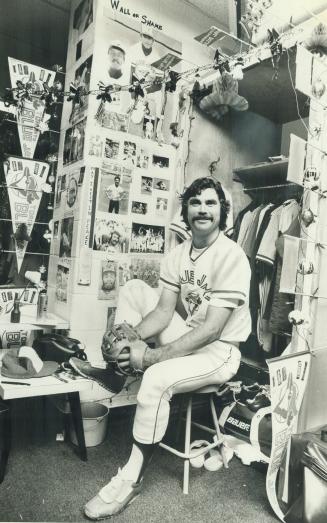 Clean-cut Blue Jays. Tim Johnson, infielder with Toronto Blue Jays, has decorated locker in Jays' dressing room at Exhibition Stadium with assortment (...)
