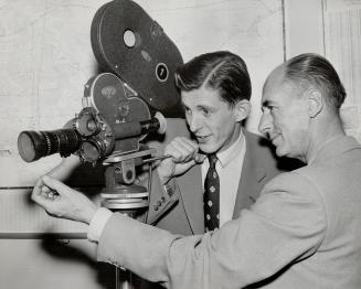 Johnston, left, examines CBC camera