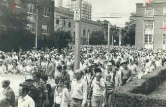 Part of the crowd of more than 2,000 people who joined historian Donald Jones on his walk yesterday, stroll down Beverley St. to George Brown's house.(...)