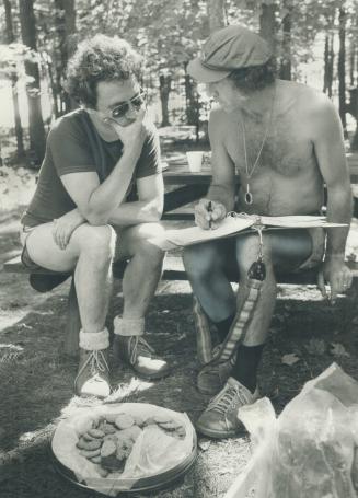 Claude Jutra and cameraman Richard Leiterman discuss a scene during the filming of Surfacing