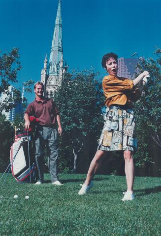 On the ball for the ballet. National Ballet of Canada principal dancer Karen Kain gets a few tips from Glen Abbey golf pro Bob Lean yesterday, hitting(...)