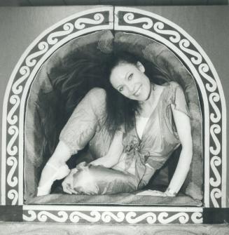 Ballerina boxed in. National Ballet principal dancer Karen Kain tries out a prop box or bed used in The Soldier's Tale, a ballet by Stravinsky that wi(...)