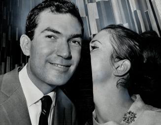 A wifely kiss for Robert Kaplan