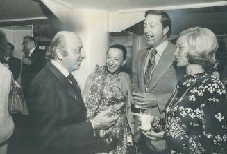 Photographer Yousuf Karsh and his wife Estrellita chat with television personality Pat Murray, and Mrs