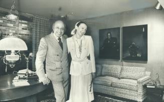 Famed photographer Yousuf Karsh and his wife Estrellita stand in the room designed to suit his Capricorn personality