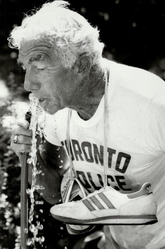 He's just warming up: Art Keay cools off after practicing for his 162-kilometre (101-mile) walk to publicize the police games