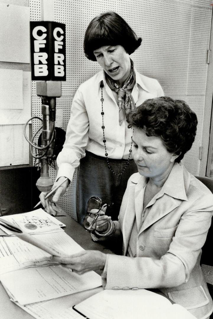 Irene Wilson (standing) and her boss