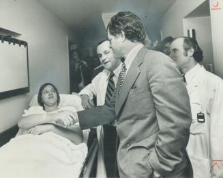 Senator Edward Kennedy shakes hands with patient Tom Dwyer, 16, of Gravenhurst, during a visit to Toronto General Hospital yesterday, while Dr. Harold(...)