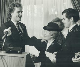 Winning smile: Joe Kennedy Jr., left, shares a laugh with Phylis Bobbitt after presenting a cheque for the needy to her husband, Gordon, a Salvation A(...)
