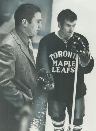 Maple Leaf captain Dave Keon (right) chats with team general manager Jim Gregory today at Maple Leaf Gardens