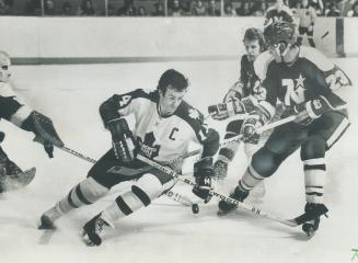 Fans, below, praise Leaf captain Dave Keon, seen here in game earlier this year with Minnesota North Stars