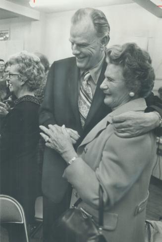 Conservative winner George Kerr, Ontario minister of energy and resources management, stands with his arm around his mother after learning he had carr(...)