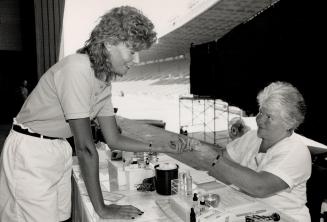 Stadium bloodletting. Cindy Key gives Ann Noble a test blood sample at a clinic next door to Exhibition Stadium to boister diminished Red Cross suppli(...)