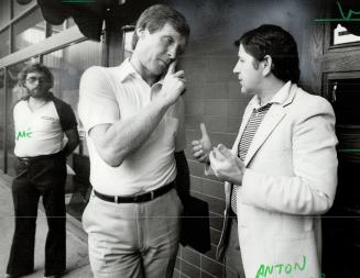 In conference: Anton Kikas, right, promoter of last night's game that did not take place, explains to Billy McNeill, manager of Celtic, what went wrong
