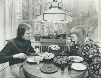 Actors Tom Kneebone and Dinah Christie finish a meal with salad and open-faced early Canadian apple pie