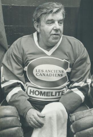Exhausted: Gump Worsley relaxes and tries to find energy to change clothes after playing for Montreal Oldtimers against Toronto Oldtimers yesterday at Gardens