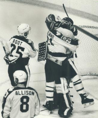 Hug for huge save: Leaf's' Borje Salming hugs Ken Wregget after the Leafs goaltender robbed Gino Cavallini of a what seemed like a sure goal with just over a minute remaining in playoff game
