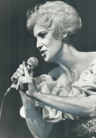 Dull dignity: Tammy Wynette's performance at the Metro Police Association benefit at Maple Leaf Gardens was about as exciting as a Sunday stroll, says critic Peter Goddard