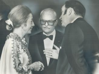Movie Mogul Darryl Zanuck talks with Mrs