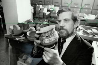 Piece of history: Prof. Cuyler Young of Royal Ontario Museum examines pottery found in digging expedition he led to western Iran