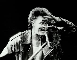 Paul Young is no hard rocker. In Western-frill leather jacket and bum-hugging tights Friday night, Young was rock's soft-eyed boy of summer, and seems destined to remain so