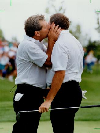 $50,000 Kiss: Fuzzy Zoeller thanks Canadian Dave Barr for missing a putt on the 18th, which gave Zoeller a skin worth $50,000
