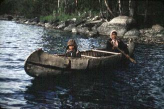 Adult and child in a canoe