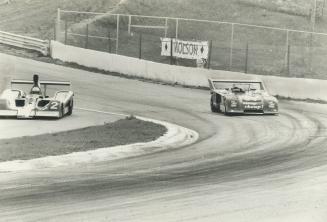 Warwick Brown (2) heads for pits while Peter Smith negotiates turn during Can Am qualifying at Mosport