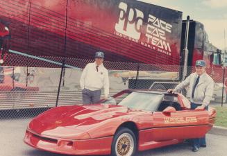 Jack MacMillan, right, admires PPG pace car for this weekend's race