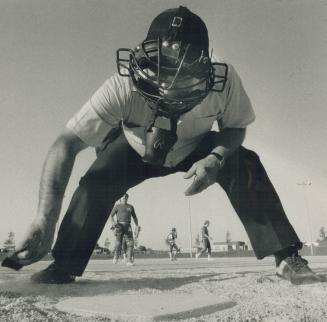 Let's play ball! Umpire Peter Dalessandro dusts off the plate at L' Amoreauz Park Sports Centre, one of a number of bursting-at-the seams sports facil(...)