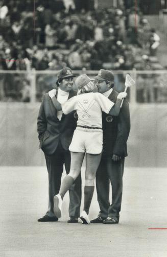 The weather was cold, but umpires Jim McKean (left) and Greg Kose were welcomed warmly by new ball girl Sara Karlsson during Blue Jays' home opener wi(...)