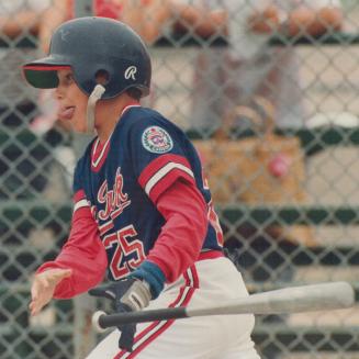 Mike Jurkiewicz, third baseman for High Park Little League team, gives it his all and them some as he lashes out a single to help his team to 4-1 win (...)