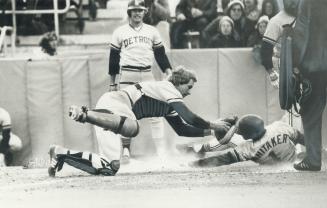 The tiger didn't make it. Detroit Tiger infielder Lou Whitaker reaches for home plate in attempt to score against Blue Jays in yesterday' home opener (...)