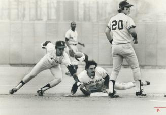 Jays' Dave McKay slides into second after doubling in middle of Toronto's six-run inning against Yankees