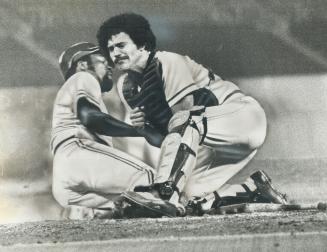 Taylor Duncan of Oakland A's is tagged out at the plate by Blue Jays' Rick Cerone in seventh inning