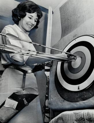 Above trick shots are feature with archery champion Joan McDonald