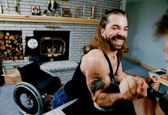 Terry Tremblett, 30, uses his friend John Ballar to demonstrate the form that has made him one of Canada's top arm wrestlers. But unless Tremblett can(...)