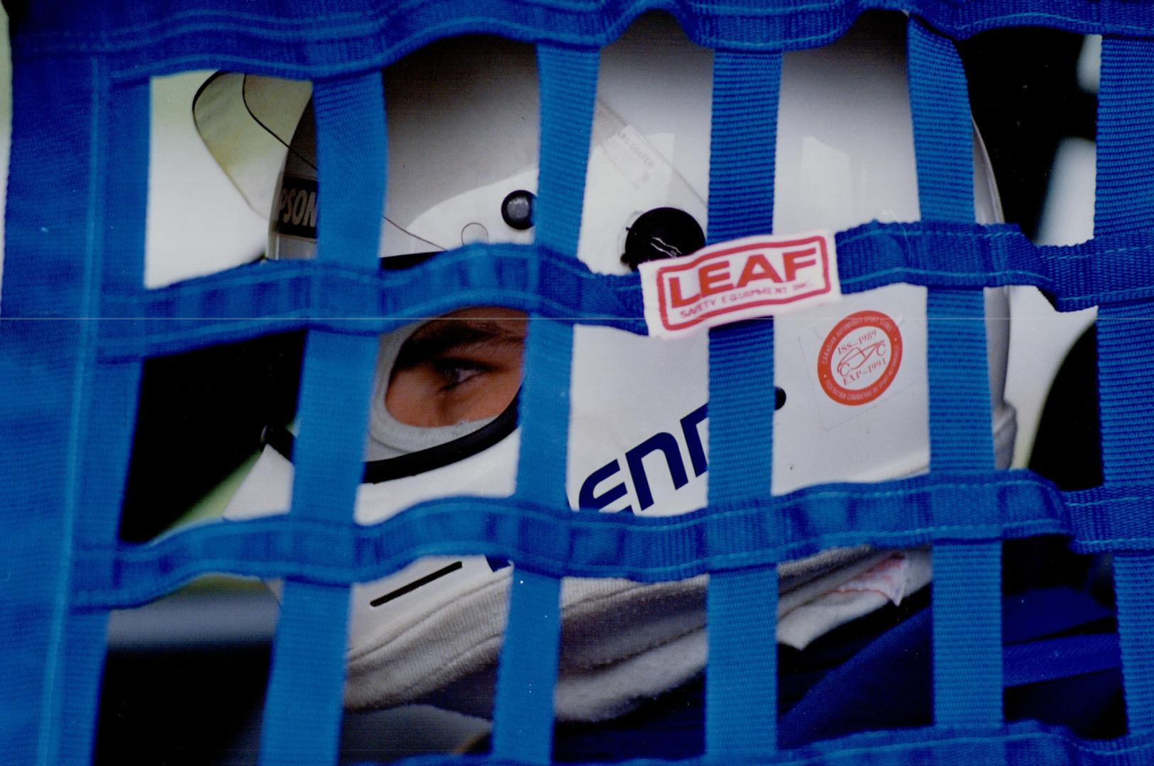 On track: One Driver gets that caged-in feeling at Mosport while Marshall Nelson of Mississauga, right, takes his Formula 1600 machine for qualifying spin